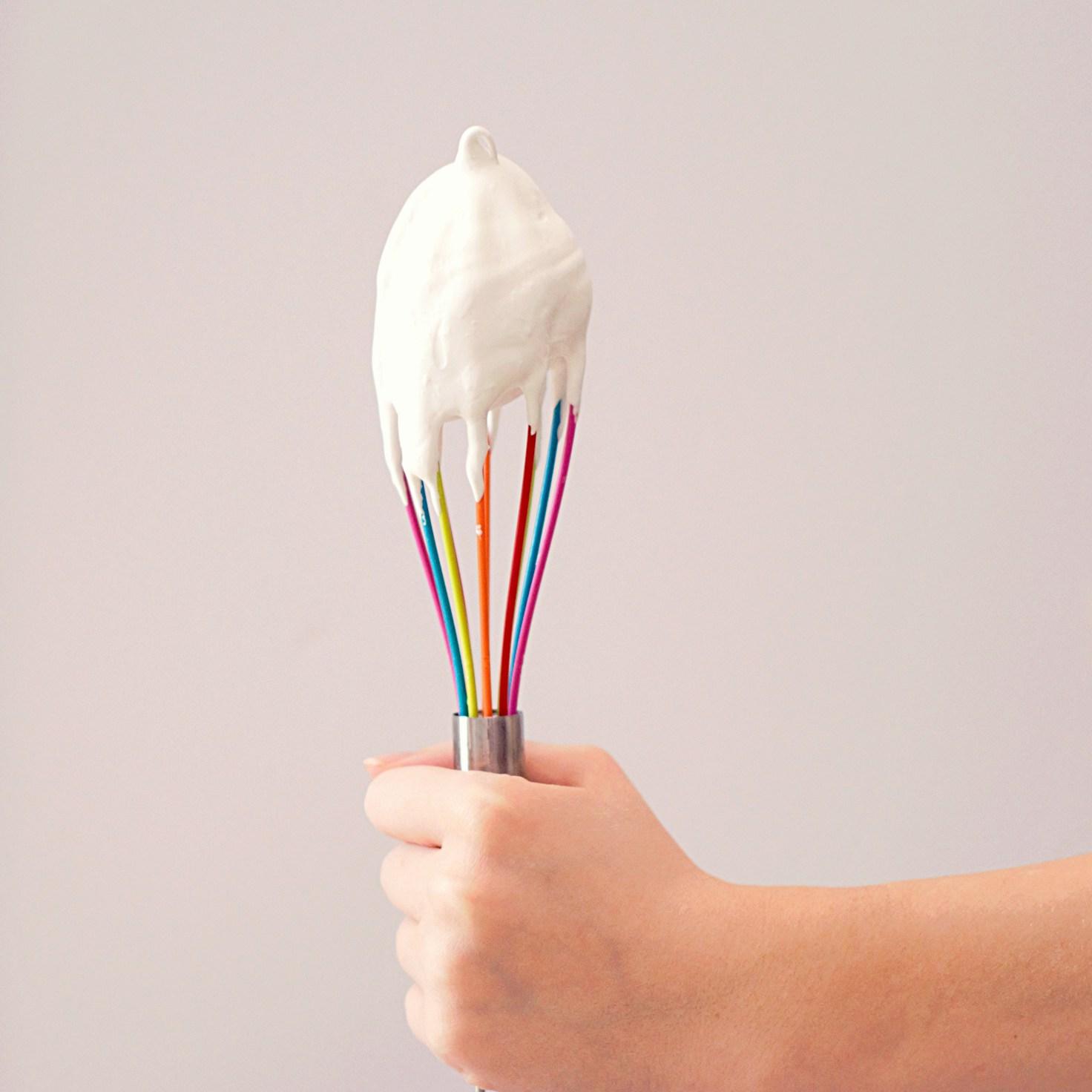Community members collaborating in a contemporary kitchen, sharing recipes and cooking techniques